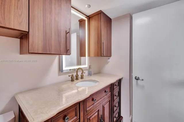 a kitchen with a table chairs sink and stove