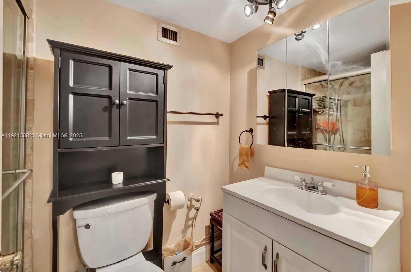 5401 Collins Avenue, Unit 340 Miami Beach, FL 33140 - Photo 54 of 54 a bathroom with a sink a toilet and shower