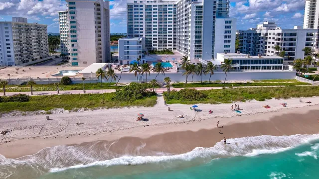 a view of street with a building and green space