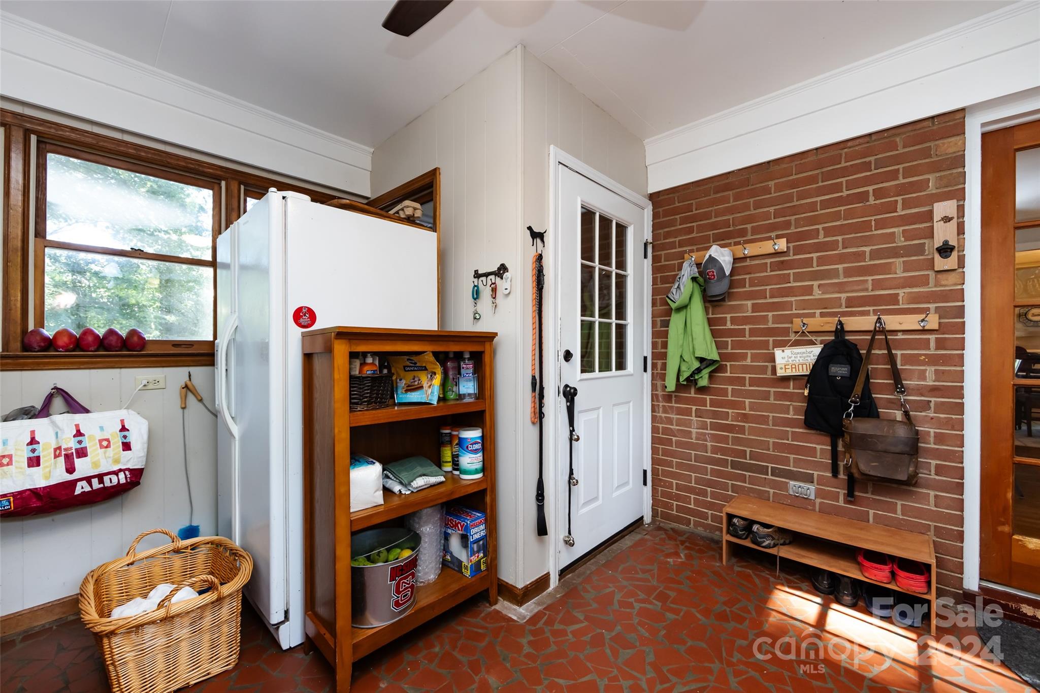 439 Boyce Road Charlotte, NC 28211 - Photo 13 of 47 a hallway with toys and a room with wooden floor