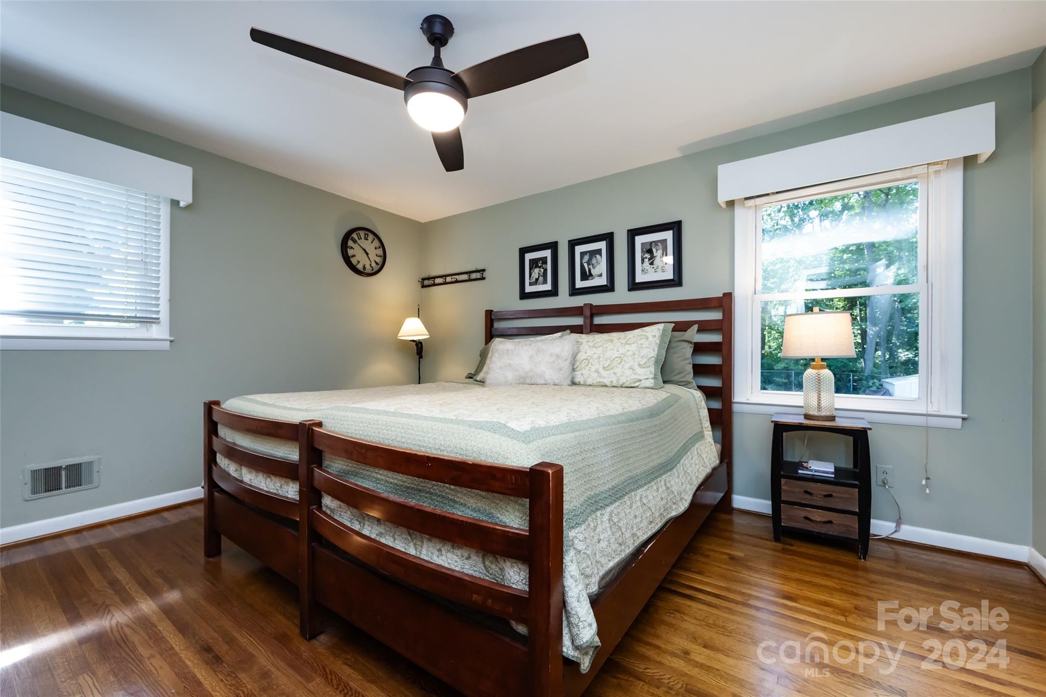 439 Boyce Road Charlotte, NC 28211 - Photo 15 of 47 a bedroom with a bed and a table in it