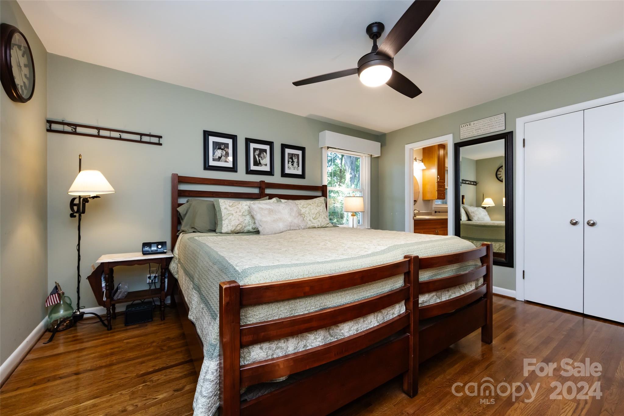 439 Boyce Road Charlotte, NC 28211 - Photo 16 of 47 a bedroom with a bed and a chandelier