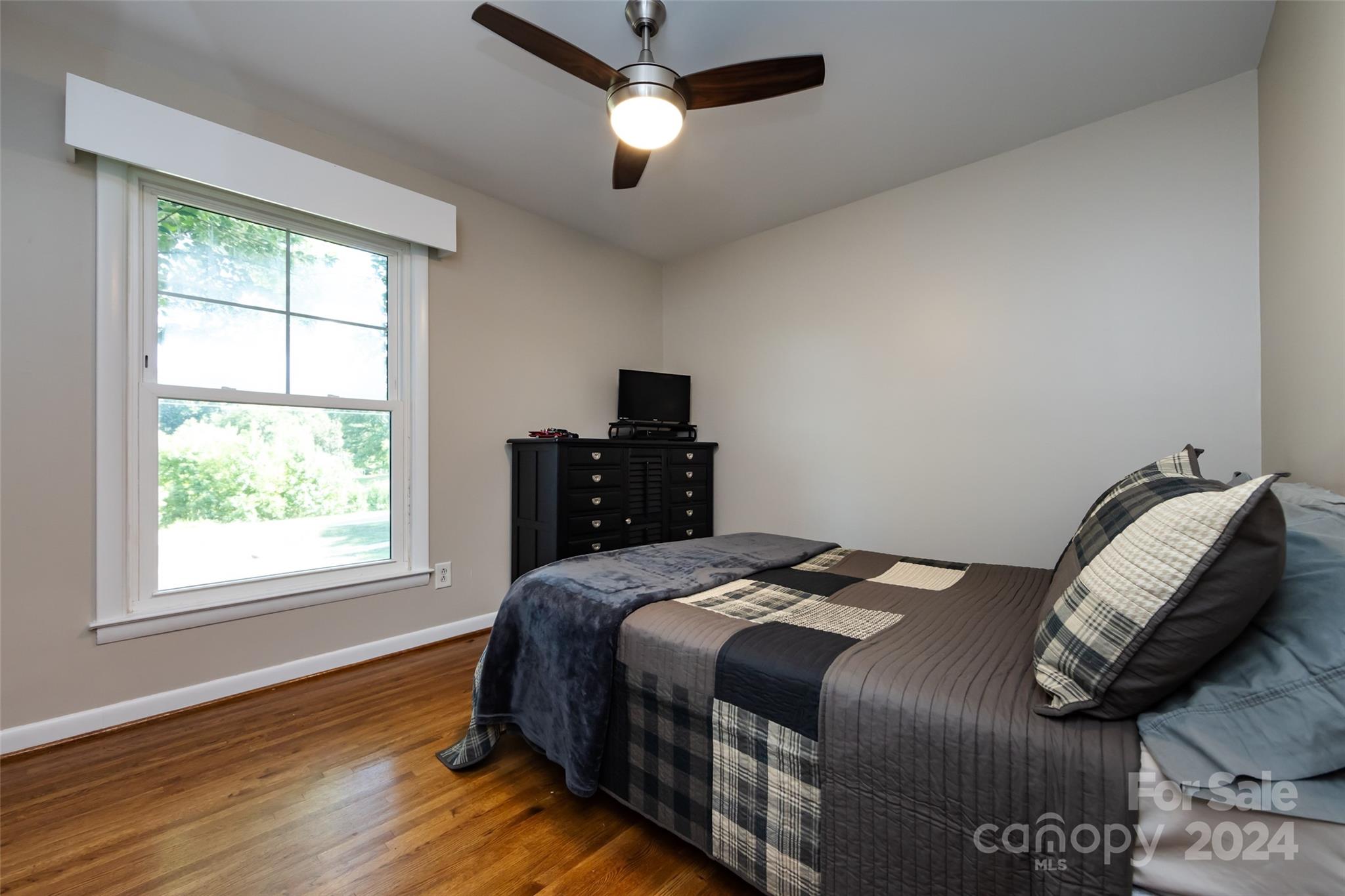 439 Boyce Road Charlotte, NC 28211 - Photo 21 of 47 a bedroom with a bed and a window