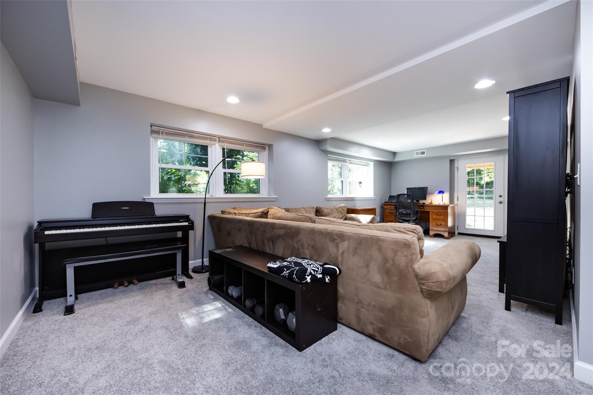 439 Boyce Road Charlotte, NC 28211 - Photo 28 of 47 a living room with furniture and a piano