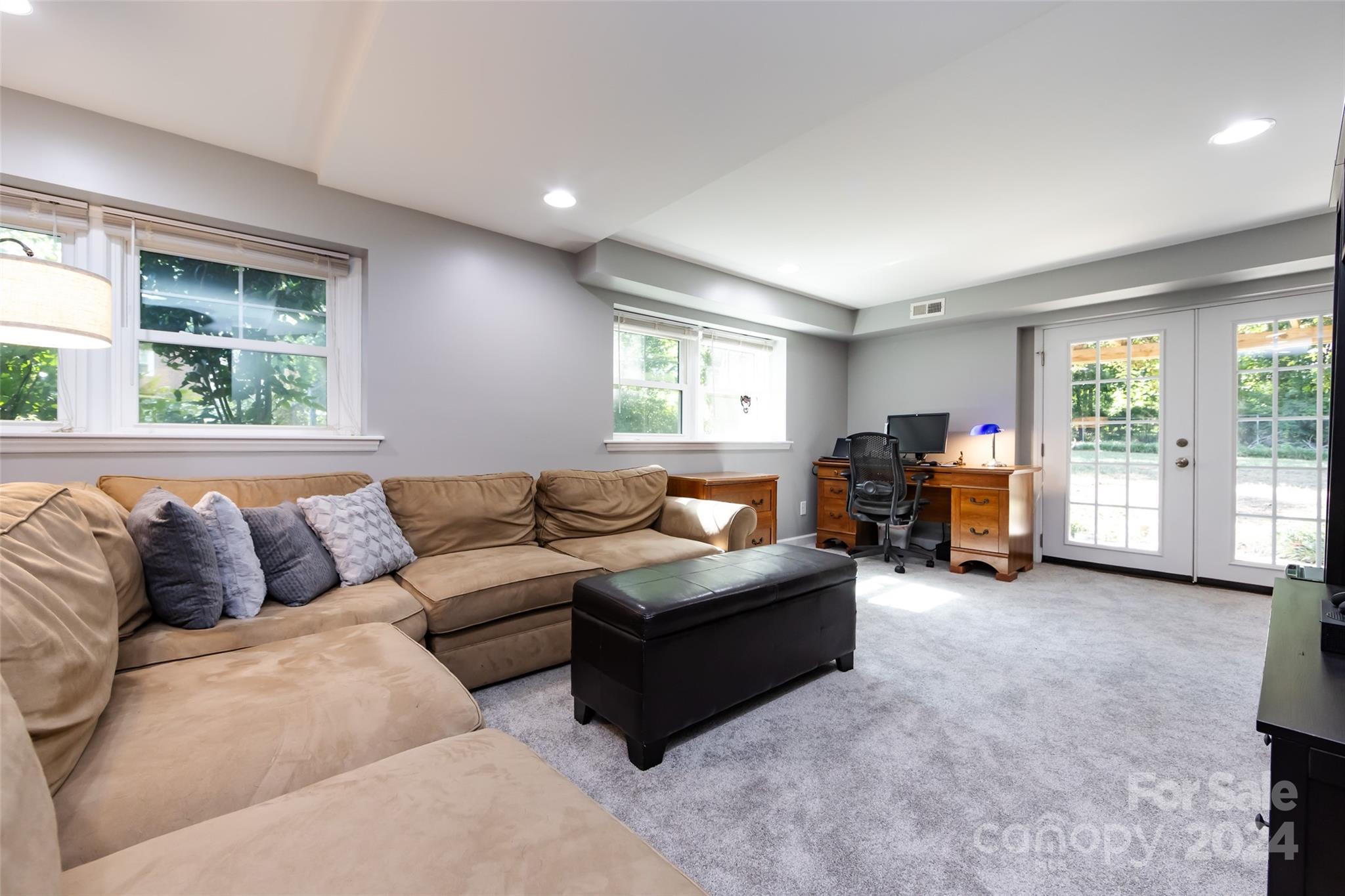 439 Boyce Road Charlotte, NC 28211 - Photo 29 of 47 a living room with furniture and a large window