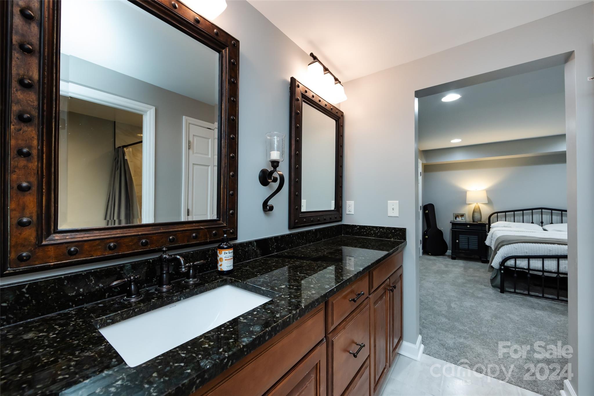 439 Boyce Road Charlotte, NC 28211 - Photo 34 of 47 a bathroom with a granite countertop double vanity sink and a mirror
