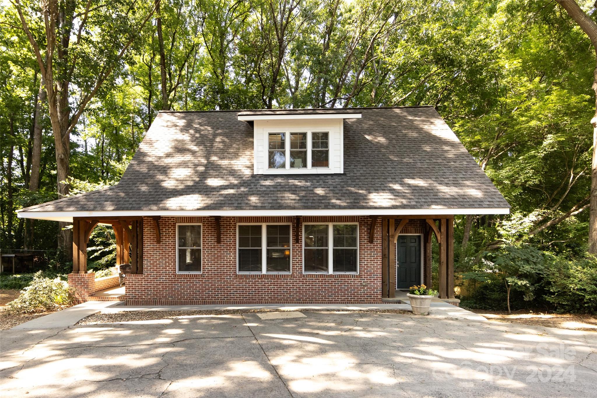 439 Boyce Road Charlotte, NC 28211 - Photo 35 of 47 a front view of a house with a garden