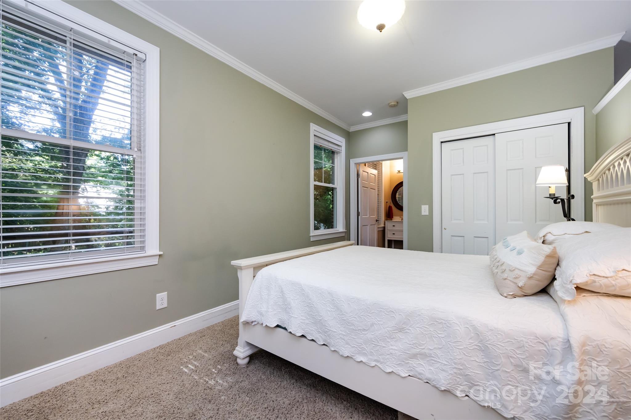 439 Boyce Road Charlotte, NC 28211 - Photo 40 of 47 a bedroom with a bed and a window