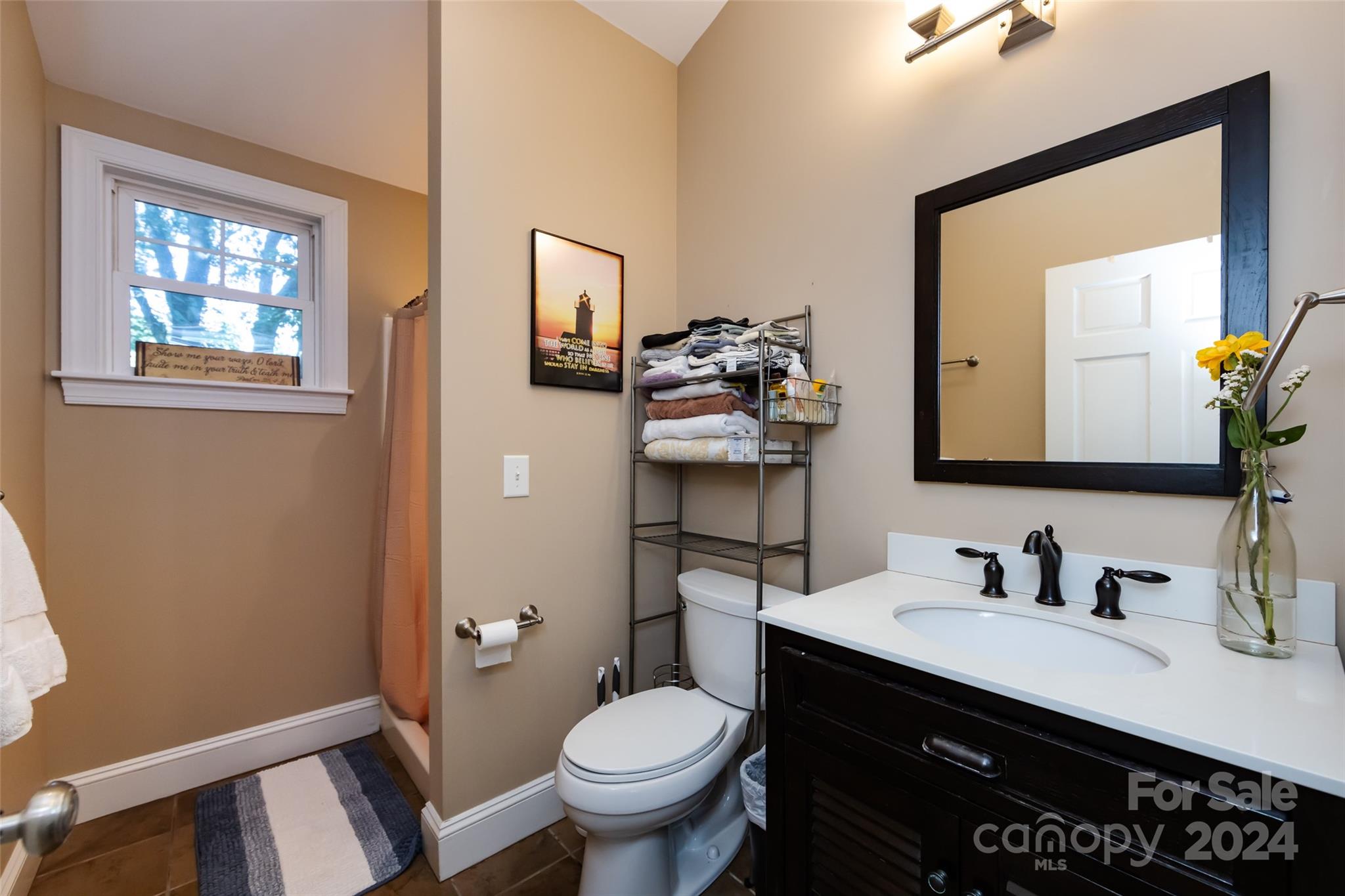 439 Boyce Road Charlotte, NC 28211 - Photo 44 of 47 a bathroom with a granite countertop sink vanity mirror and toilet