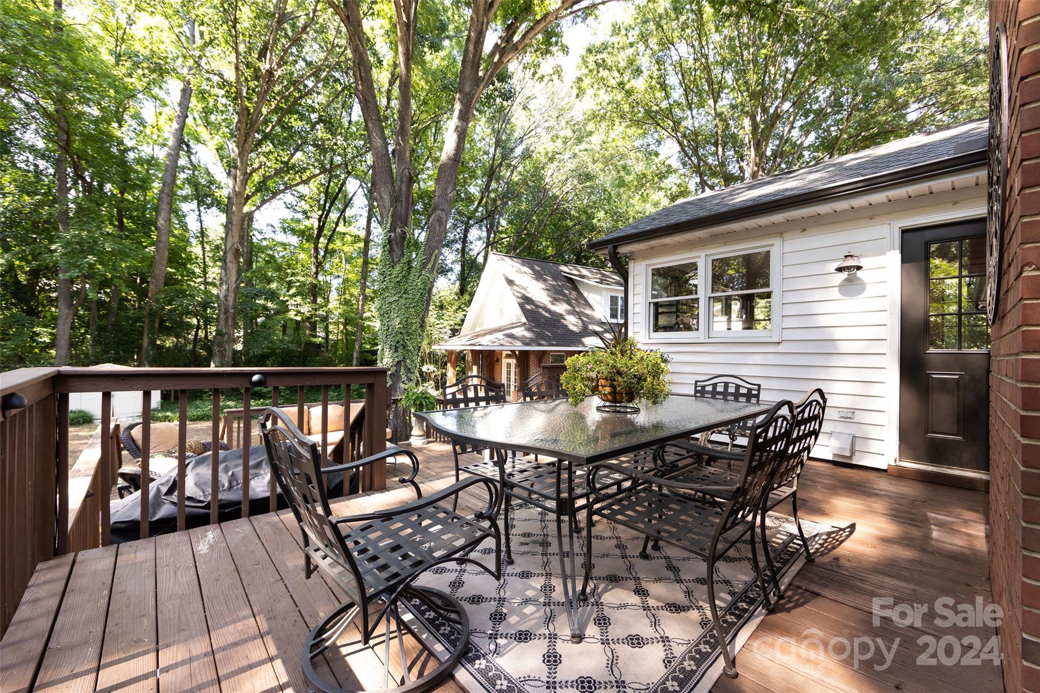 439 Boyce Road Charlotte, NC 28211 - Photo 46 of 47 a view of a chairs and table on the deck