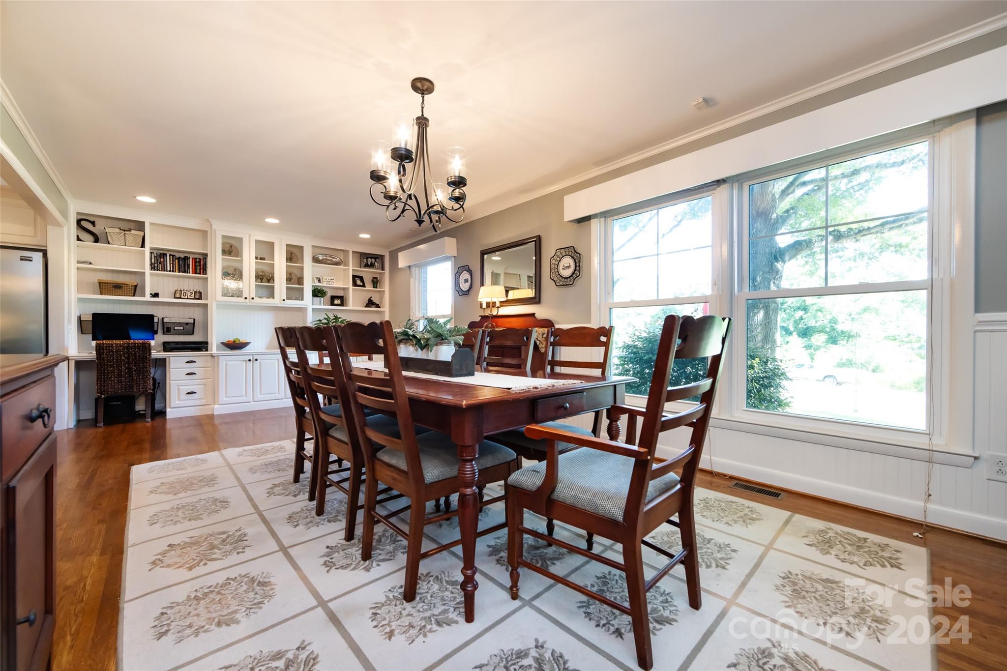 439 Boyce Road Charlotte, NC 28211 - Photo 5 of 47 a view of a dining room with furniture window and wooden floor