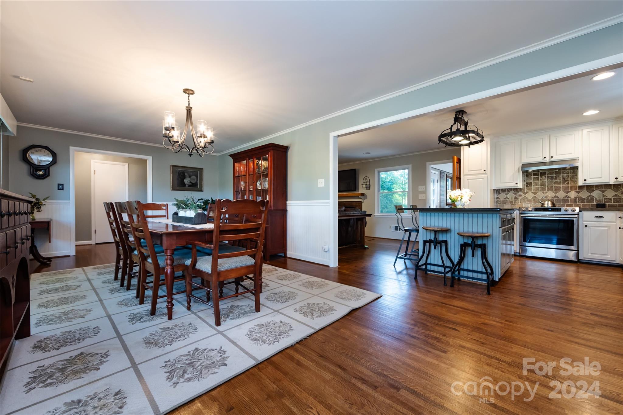 439 Boyce Road Charlotte, NC 28211 - Photo 8 of 47 a view of a dining room with furniture and wooden floor