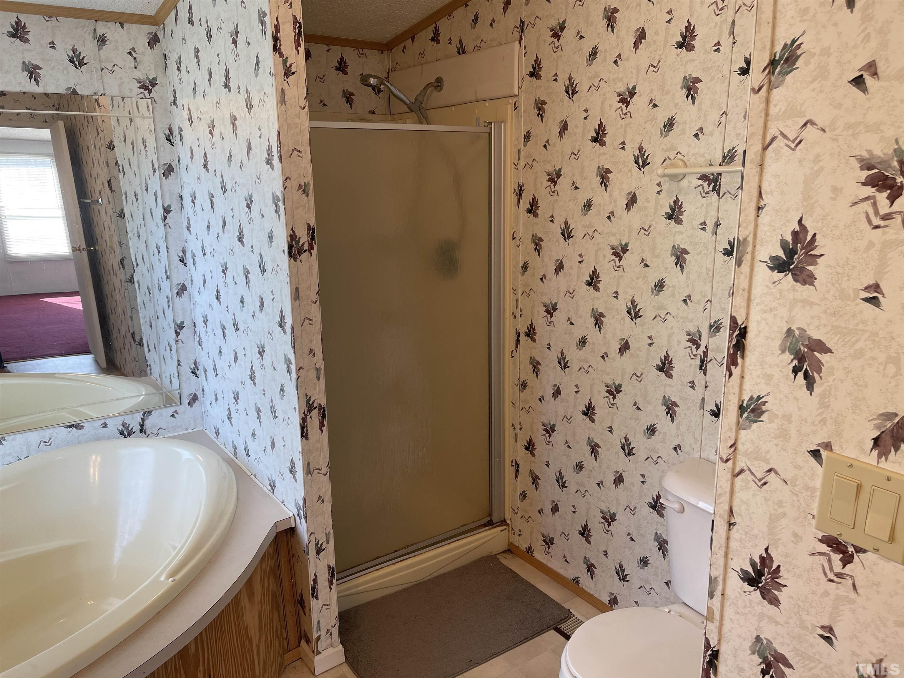 45 Beaver Run Road Spring Hope, NC 27882 - Photo 11 of 19 a bathroom with a bathtub and shower