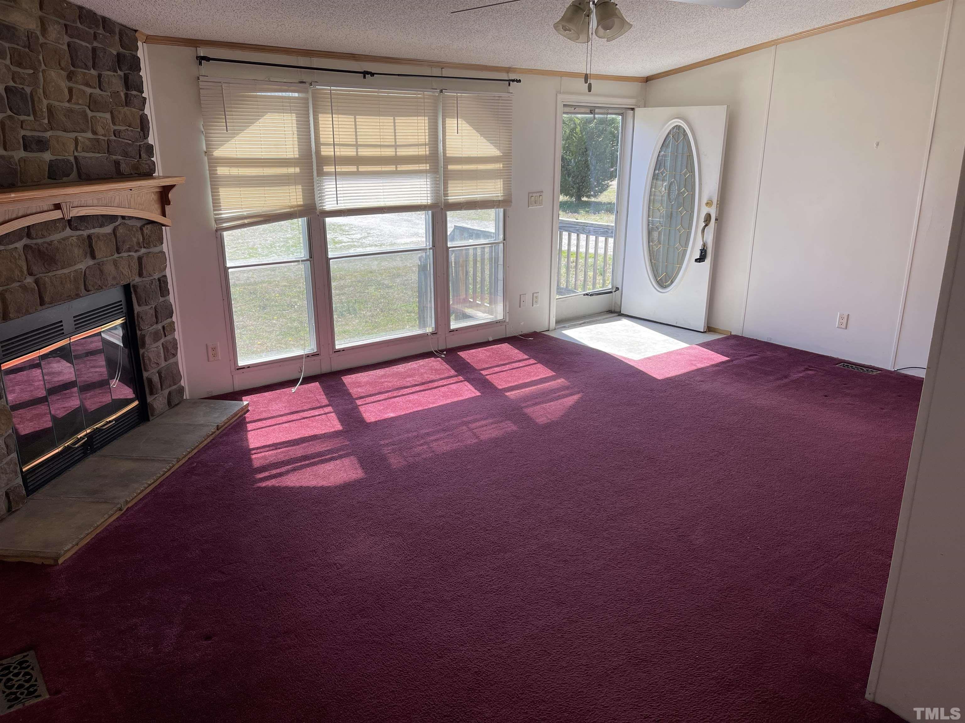 45 Beaver Run Road Spring Hope, NC 27882 - Photo 3 of 19 a bedroom with a bed a chandelier and a window