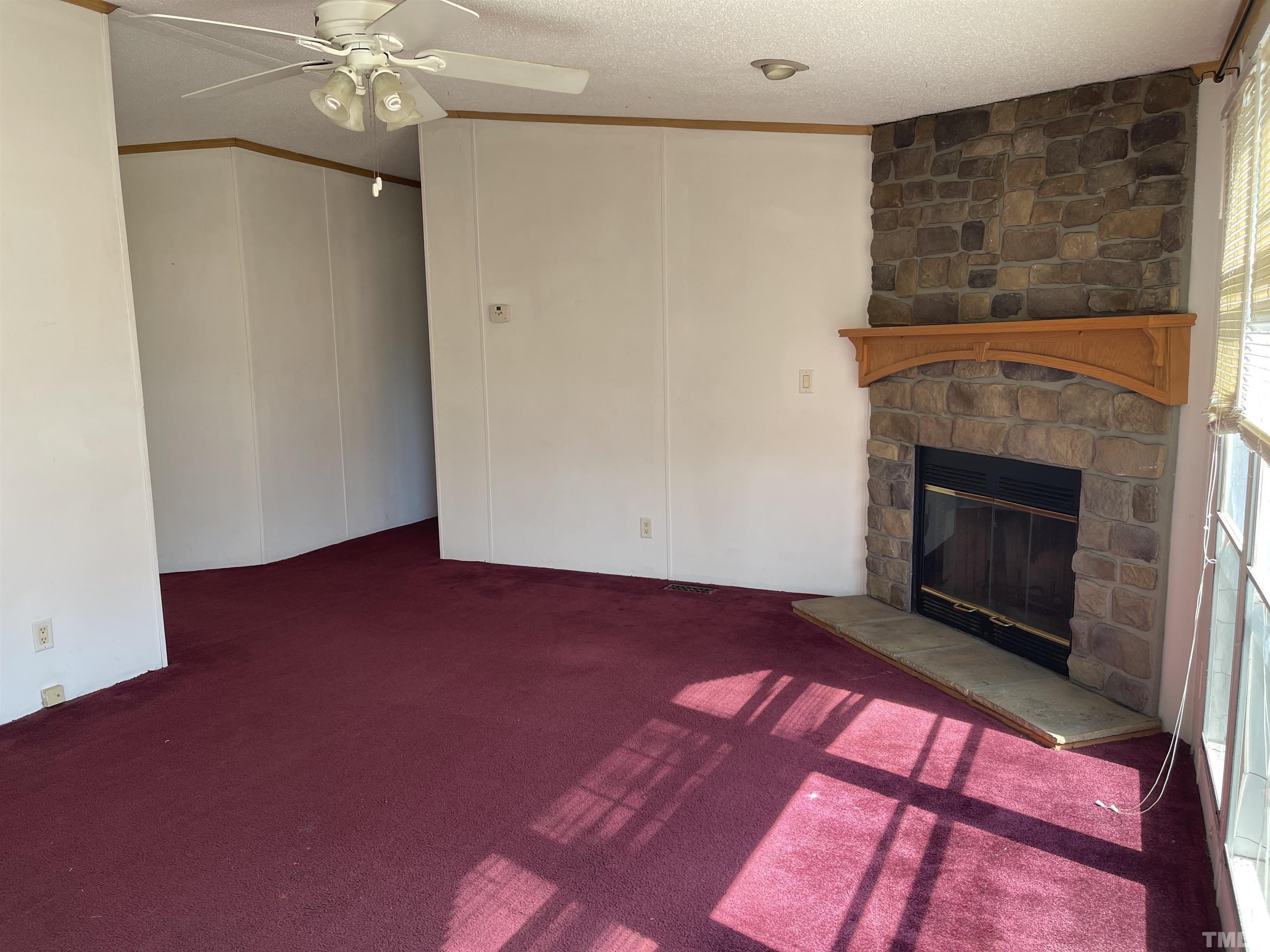 45 Beaver Run Road Spring Hope, NC 27882 - Photo 5 of 19 a view of an empty room with a fireplace