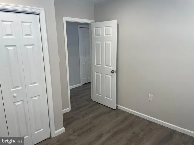 wooden floor with white walls