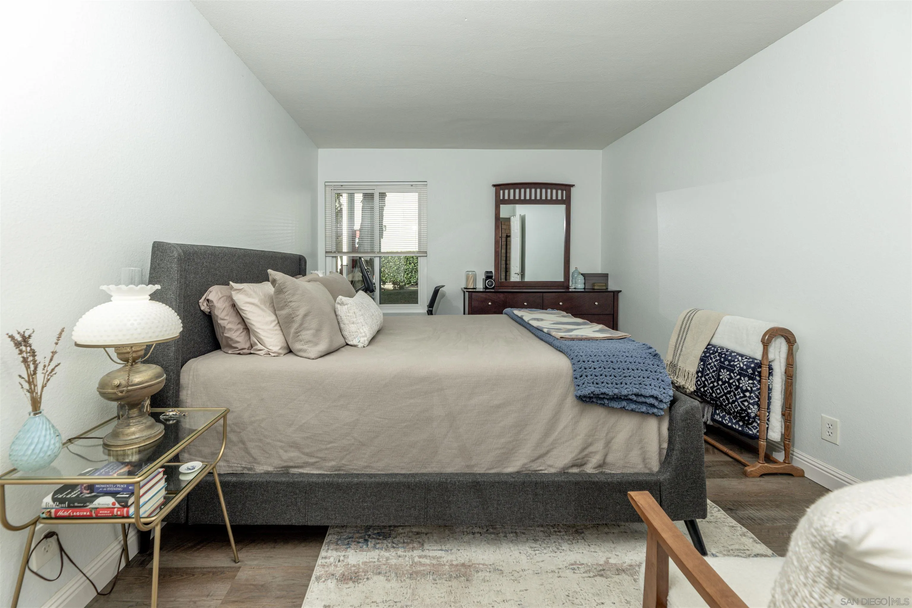 3550 Ruffin Road, Unit 155 San Diego, CA 92123 - Photo 12 of 25 a bedroom with a bed a lamp and a window