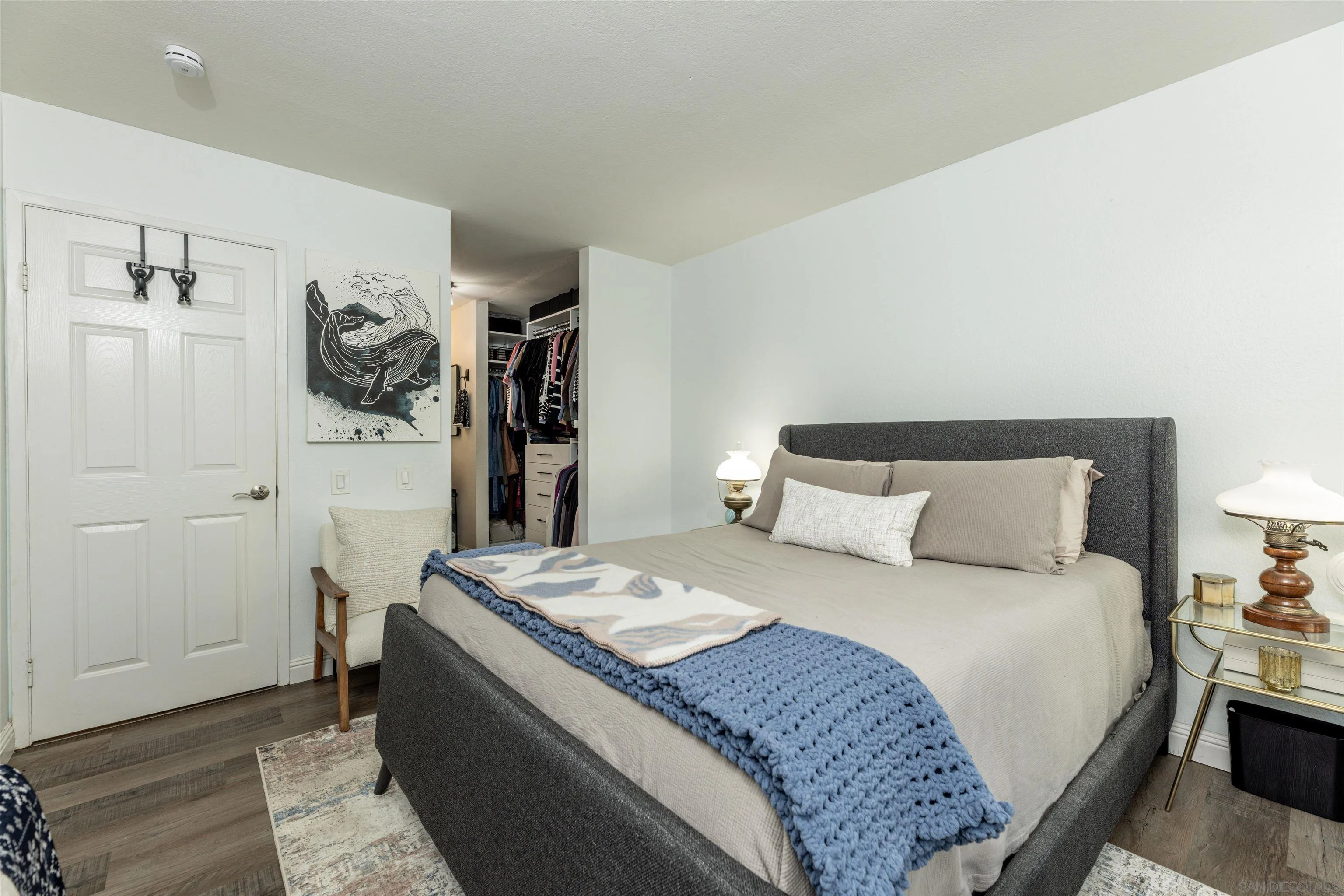 3550 Ruffin Road, Unit 155 San Diego, CA 92123 - Photo 13 of 25 a bedroom with a bed and a walk in closet