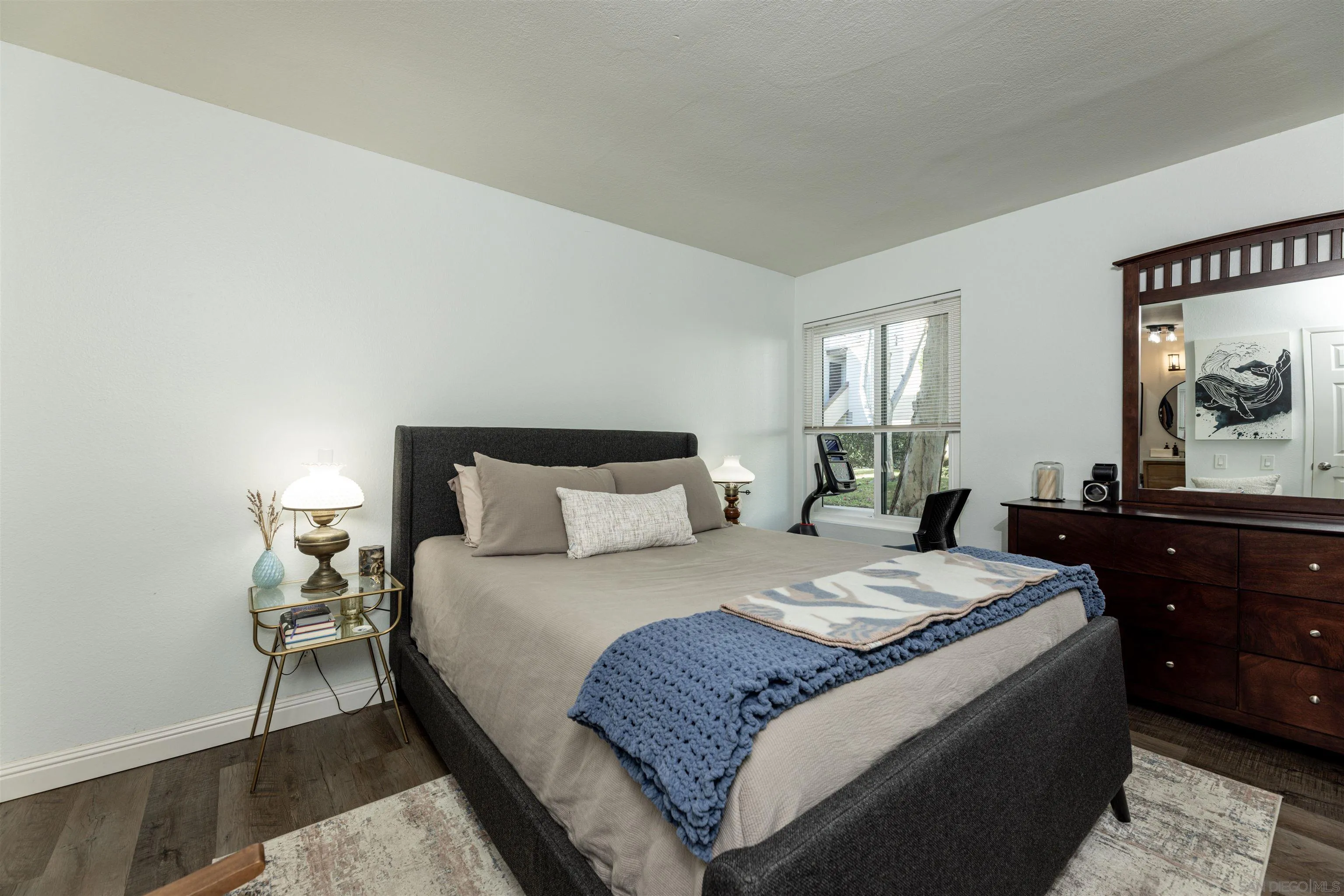 3550 Ruffin Road, Unit 155 San Diego, CA 92123 - Photo 14 of 25 a bedroom with a bed and a dresser