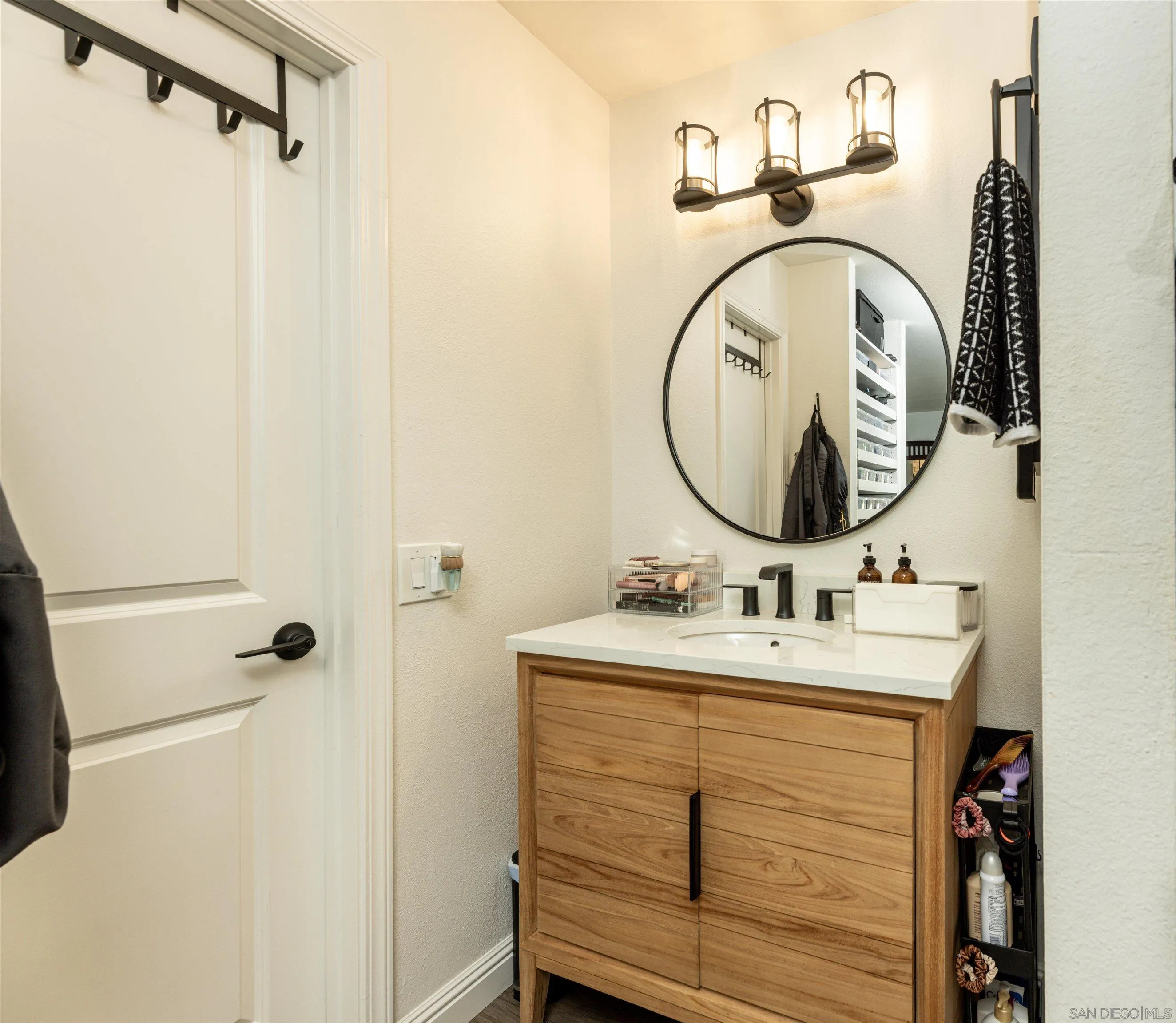 3550 Ruffin Road, Unit 155 San Diego, CA 92123 - Photo 16 of 25 a bathroom with a sink and a mirror