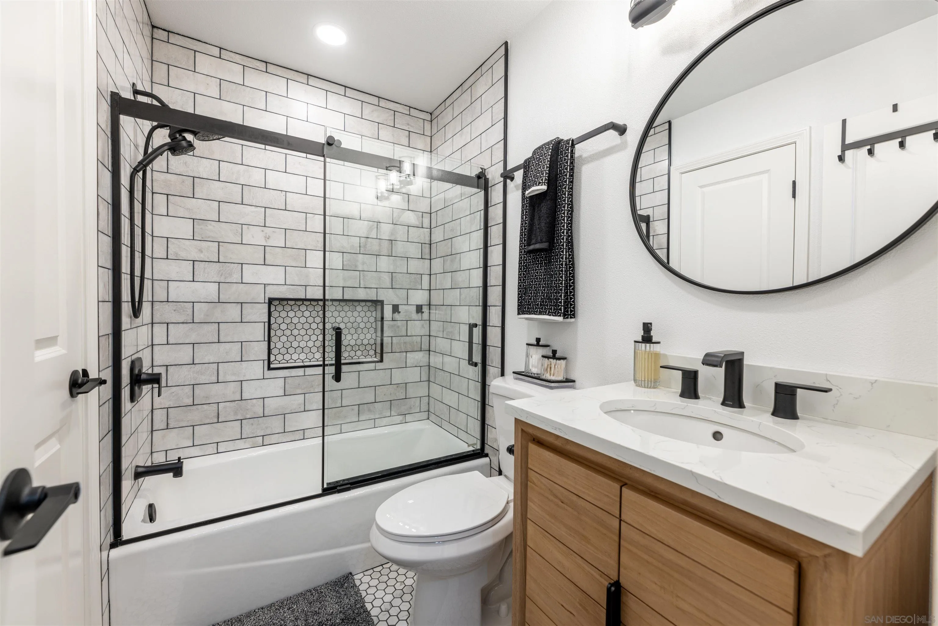3550 Ruffin Road, Unit 155 San Diego, CA 92123 - Photo 17 of 25 a bathroom with a sink toilet and shower