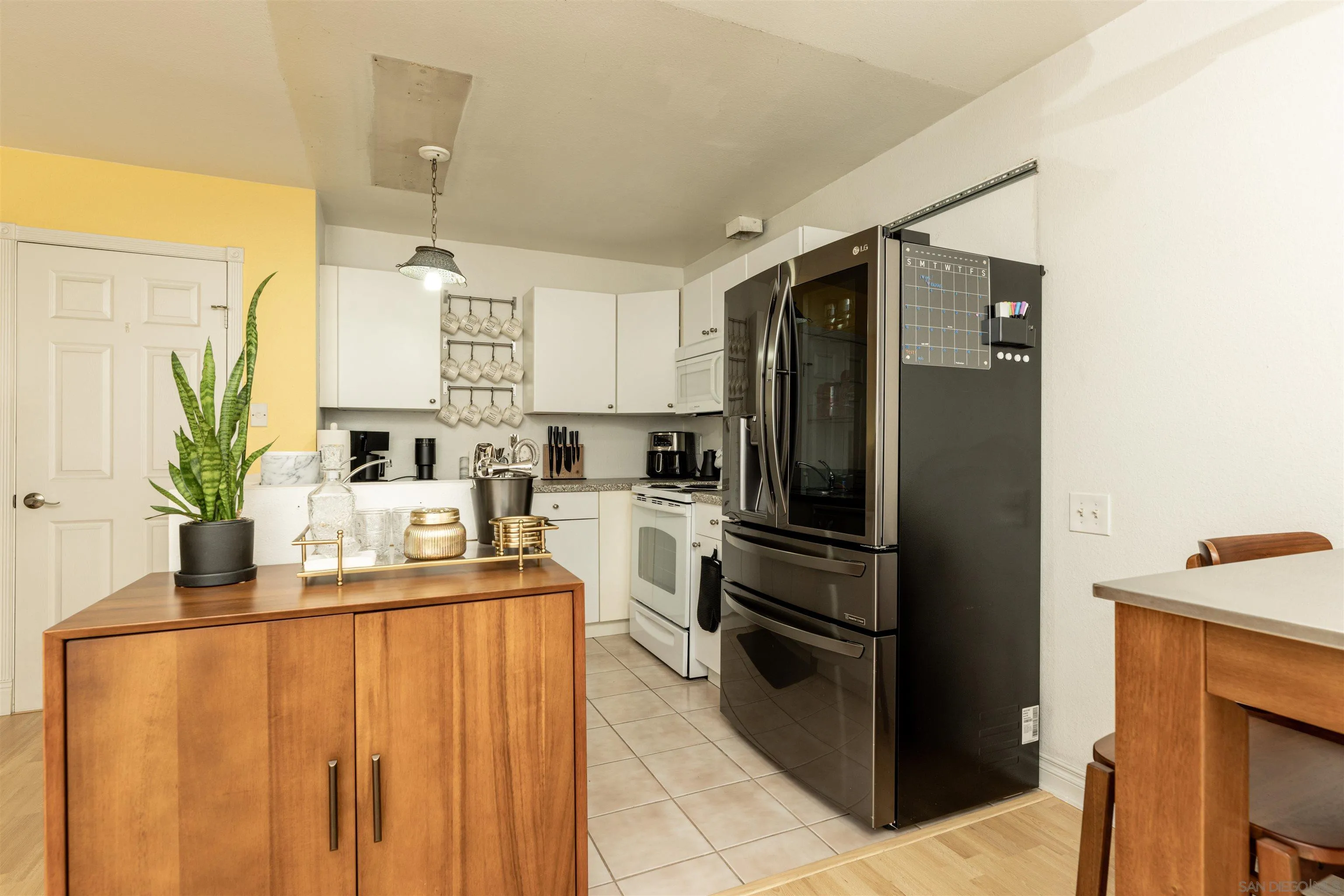 3550 Ruffin Road, Unit 155 San Diego, CA 92123 - Photo 8 of 25 a kitchen with stainless steel appliances a refrigerator and a stove