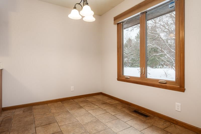 10077 Jesters Row Roscoe, IL 61073 - Photo 11 of 61 a view of empty room with window