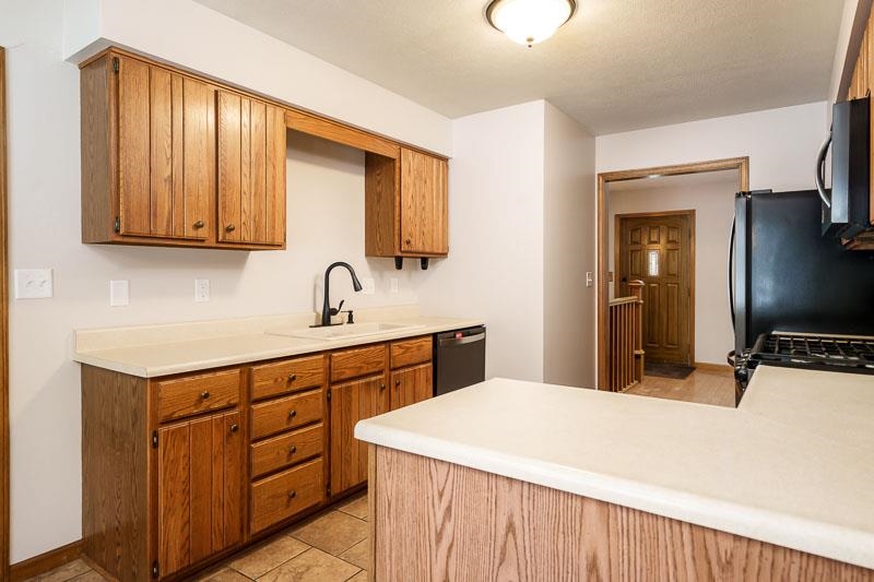 10077 Jesters Row Roscoe, IL 61073 - Photo 14 of 61 a kitchen with a sink and cabinets