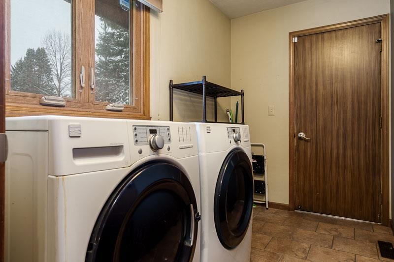 10077 Jesters Row Roscoe, IL 61073 - Photo 18 of 61 a utility room with dryer and washer