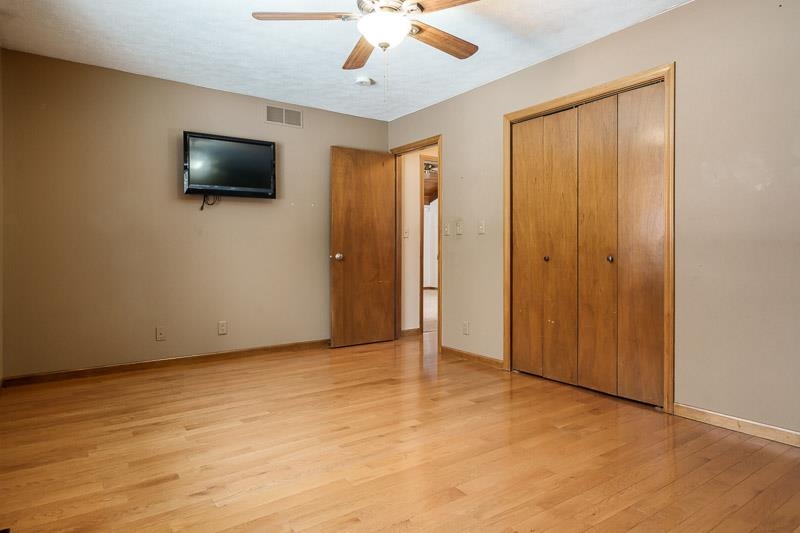 10077 Jesters Row Roscoe, IL 61073 - Photo 27 of 61 an empty room with fan and windows