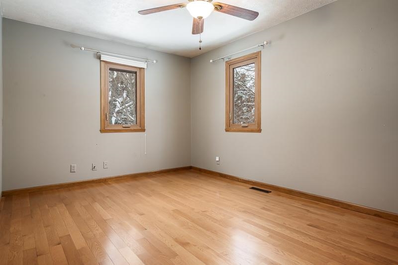 10077 Jesters Row Roscoe, IL 61073 - Photo 29 of 61 wooden floor in an empty room with a window