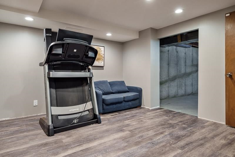 10077 Jesters Row Roscoe, IL 61073 - Photo 32 of 61 a living room with furniture and a ceiling fan