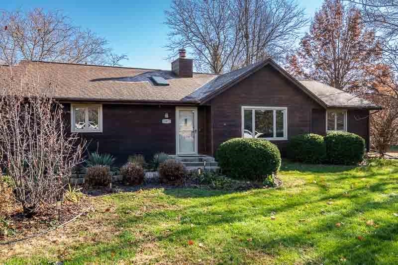 10077 Jesters Row Roscoe, IL 61073 - Photo 43 of 61 a view of a house with backyard and plants