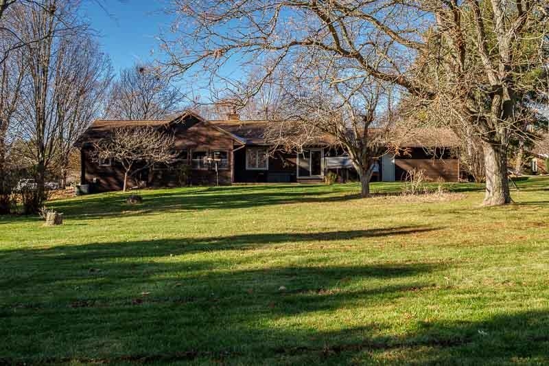 10077 Jesters Row Roscoe, IL 61073 - Photo 48 of 61 a garden view with tall trees