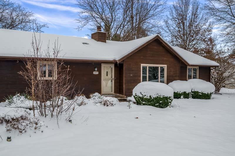 10077 Jesters Row Roscoe, IL 61073 - Photo 52 of 61 a front view of a house with a yard and garage