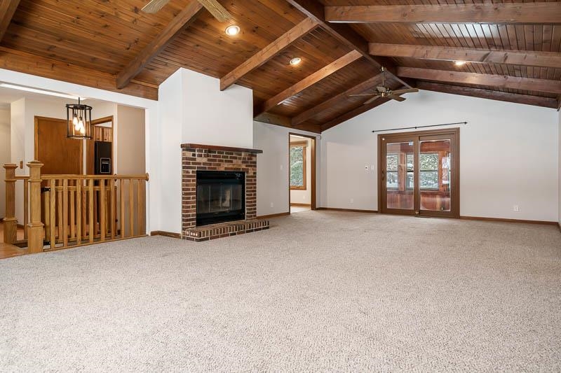 10077 Jesters Row Roscoe, IL 61073 - Photo 7 of 61 a view of empty room with fireplace