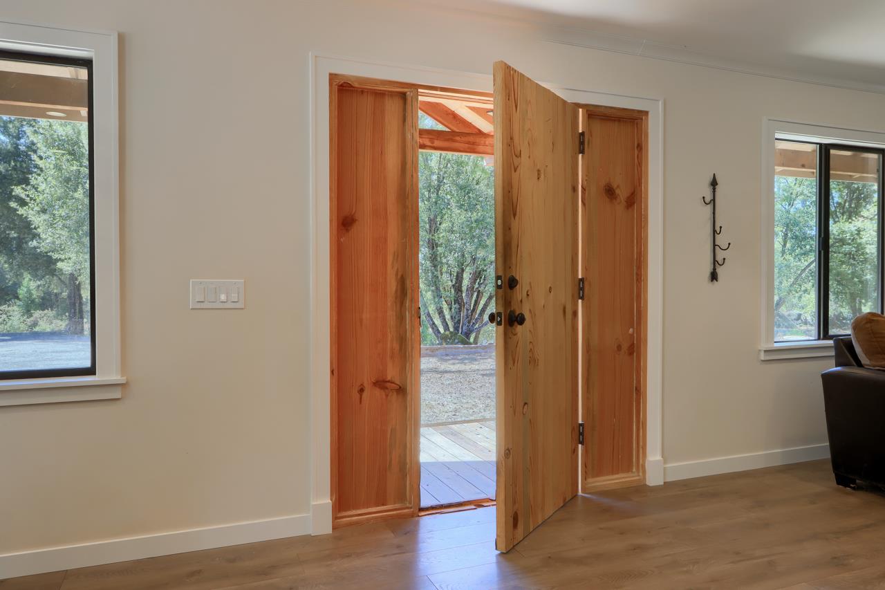 3318 Triangle Road Mariposa, CA 95338 - Photo 3 of 49 an empty room with wooden floor and windows