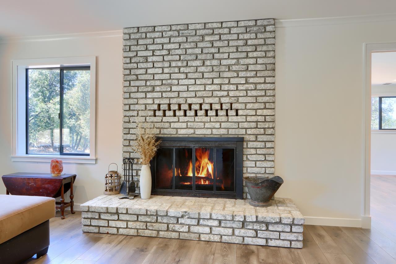 3318 Triangle Road Mariposa, CA 95338 - Photo 6 of 49 a living room with furniture and a fireplace