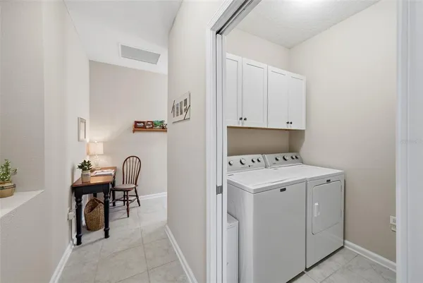 a view of a house with swimming pool and sitting area