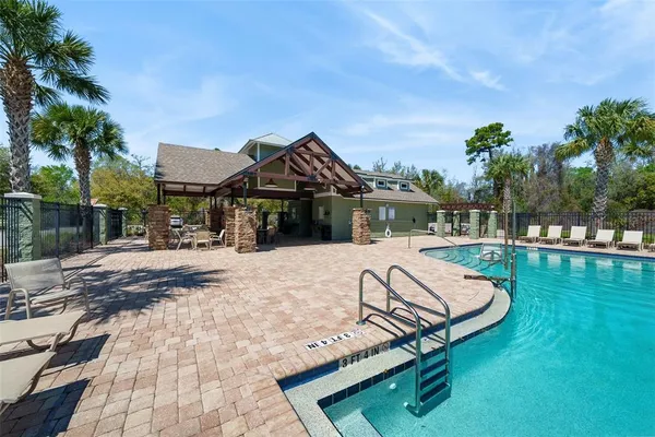 an aerial view of a house with outdoor space