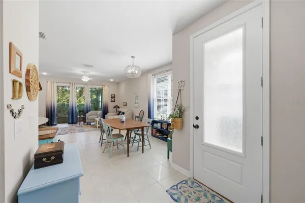 a living room with furniture a window and a flat screen tv