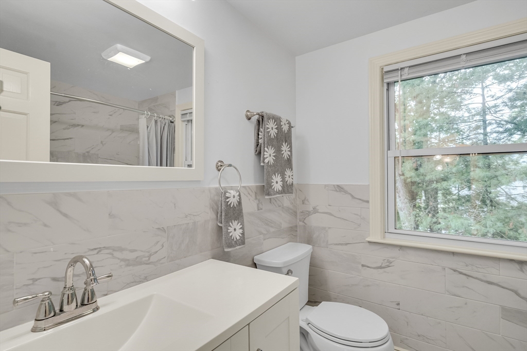 32 Dewey Road Lexington, MA 02420 - Photo 28 of 32 a bathroom with a sink toilet and shower