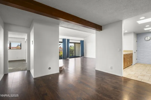 a kitchen with stainless steel appliances granite countertop a stove microwave and cabinets