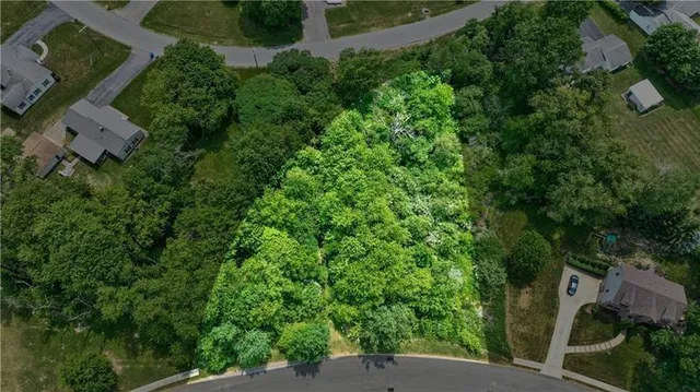 an aerial view of a house with yard