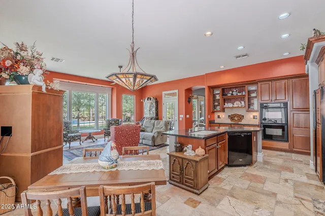 a kitchen with stainless steel appliances granite countertop a stove and refrigerator