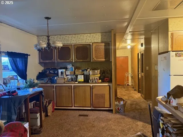 a kitchen with stainless steel appliances granite countertop a sink and cabinets