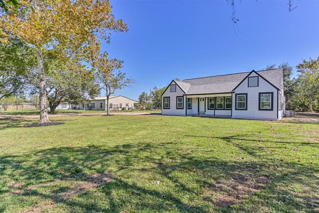 a house view with swimming pool