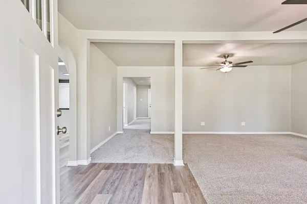 a view of a livingroom with wooden floor