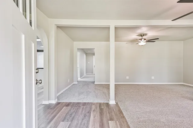 a view of a livingroom with wooden floor