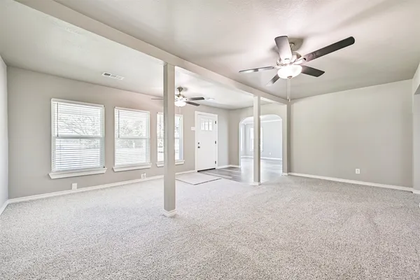 a view of an empty room with a window